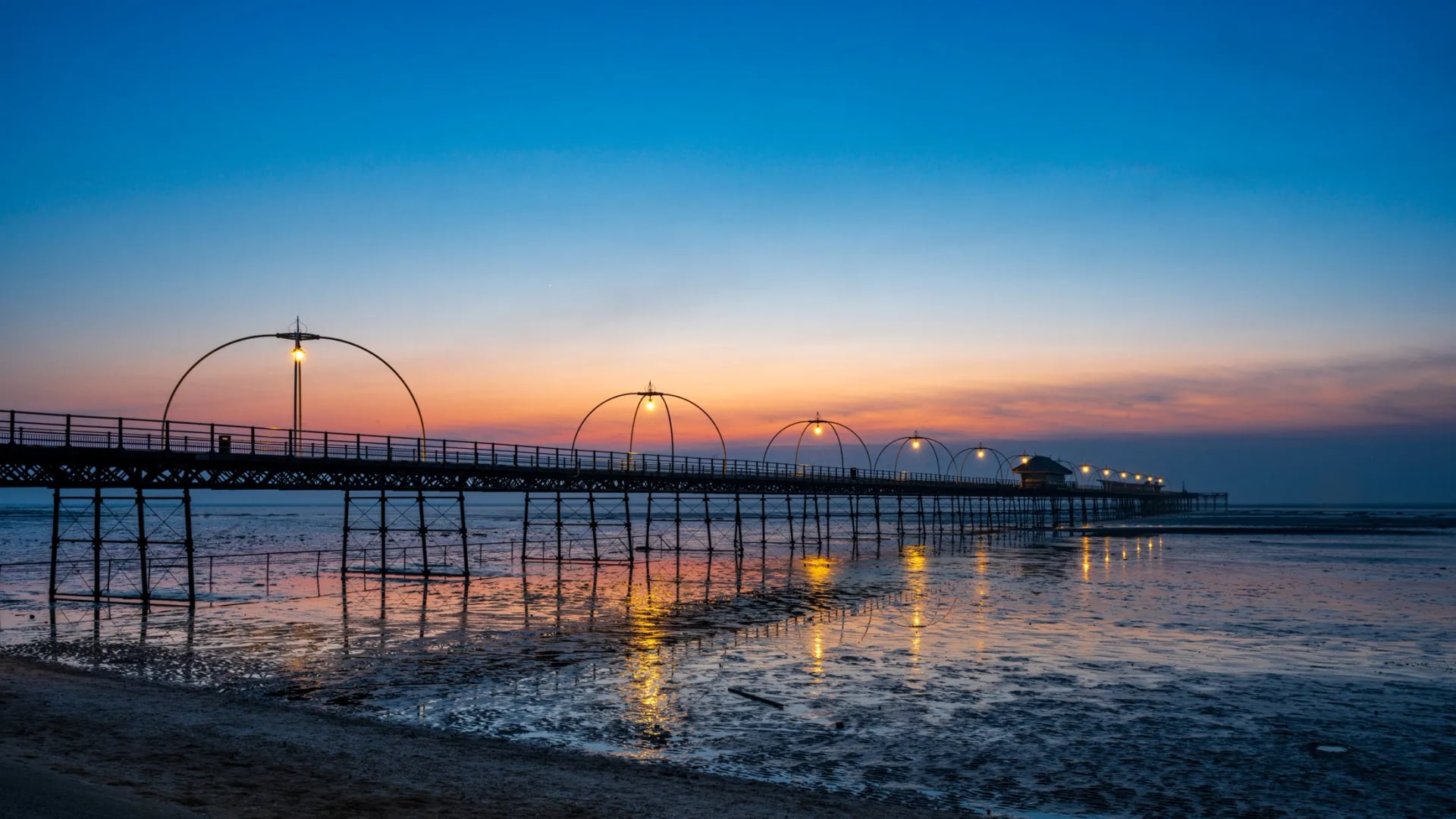 Southport Beach at low tide โ wide open calm space for autistic visitors and families